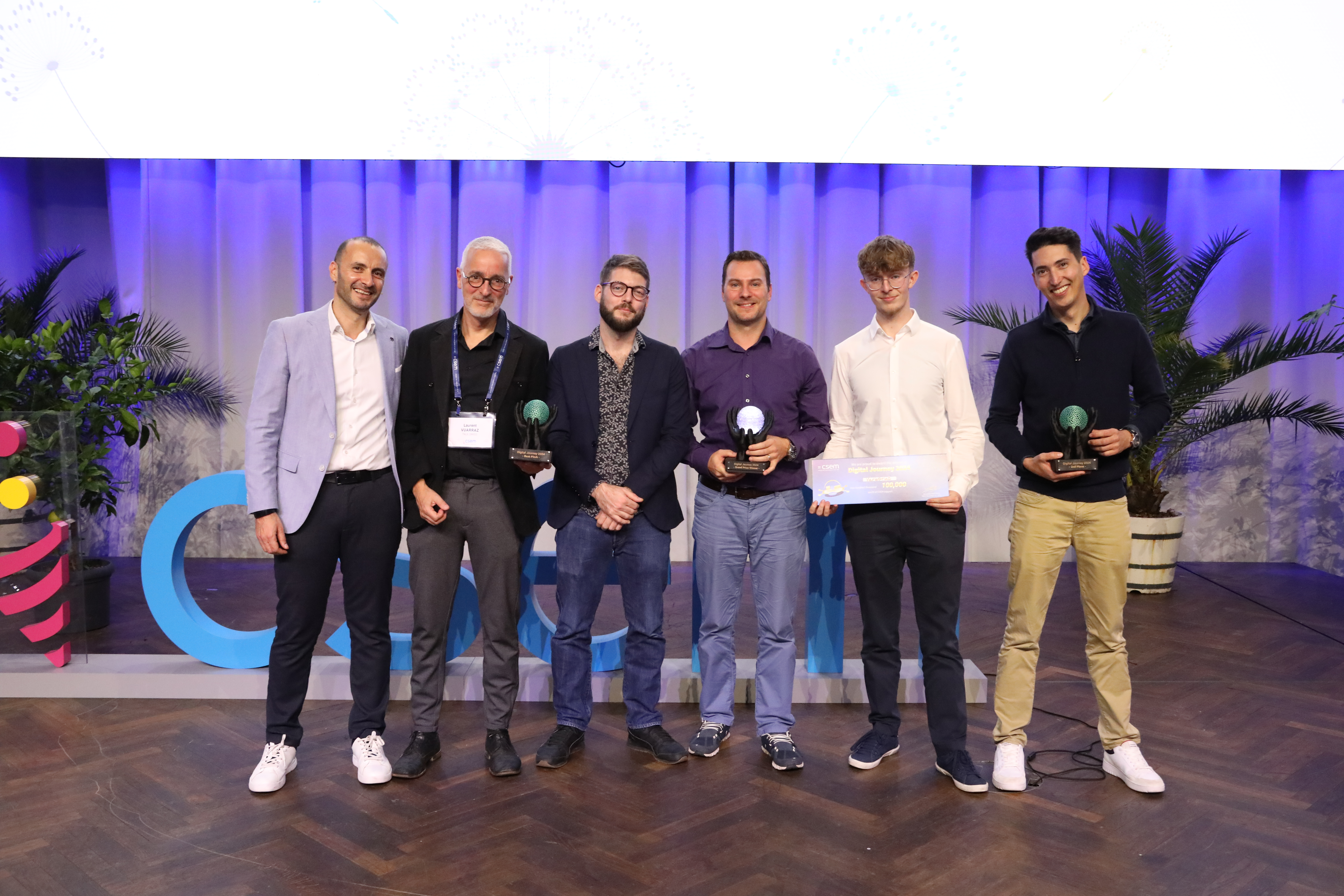 The three winners of the Digital Journey 2024 awards with Bahaa Roustom,VP Marketing & Business Development at CSEM (left) : Talk, Varioprint, Contexa