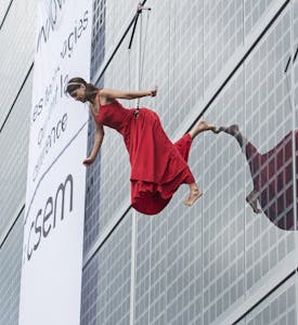 Woman performing on CSEM solar panel facade