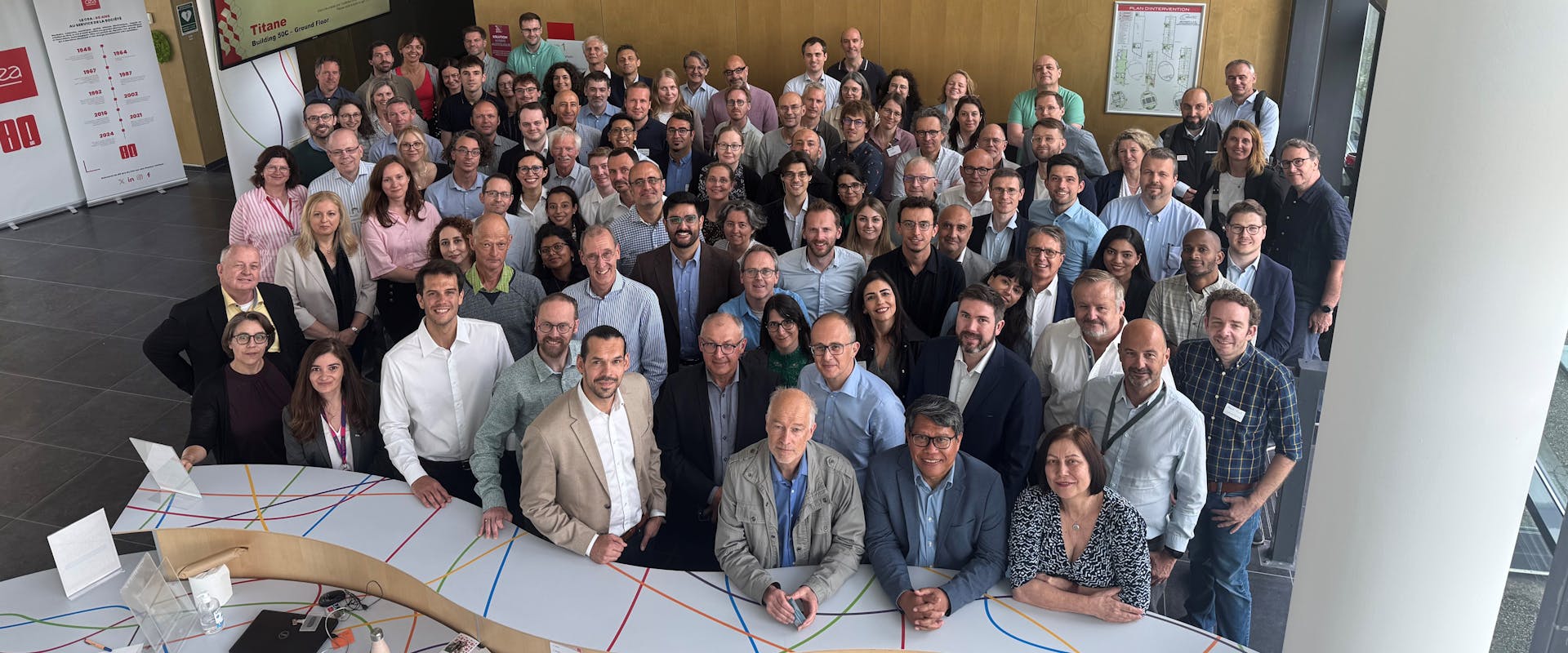 Group of multiple people standing together, who form the GENESIS kick-off team