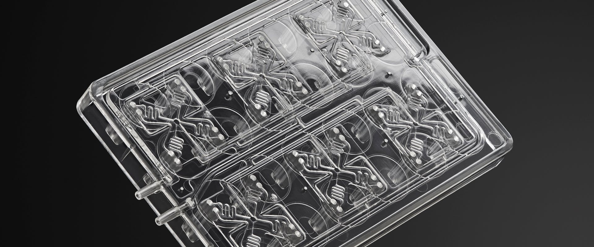 Additively manufactured microfluidic smart lids used for continuous perfusion for bioprocessing applications.