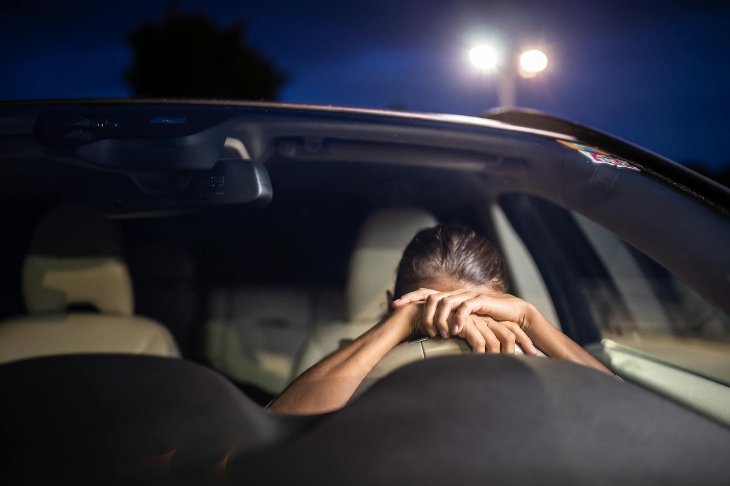 A woman in the driver’s seat suddenly collapses, showing signs of medical distress. The vehicle’s biometric monitoring system, DriverCheck, tracks her vital signs to trigger an automated safety response.