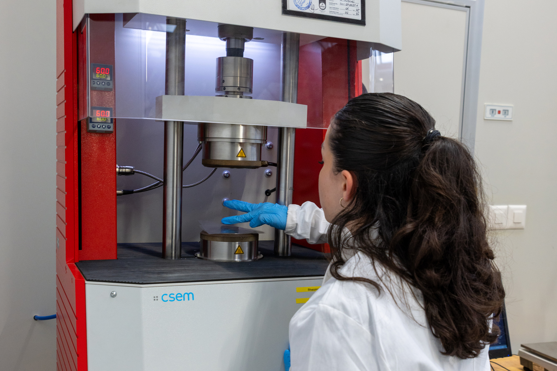 A woman conducting polymer characterization in our laboratory