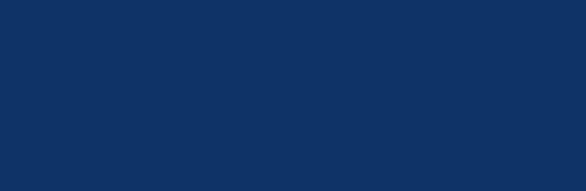 Plain dark blue background with a uniform solid color and no visible objects or patterns.