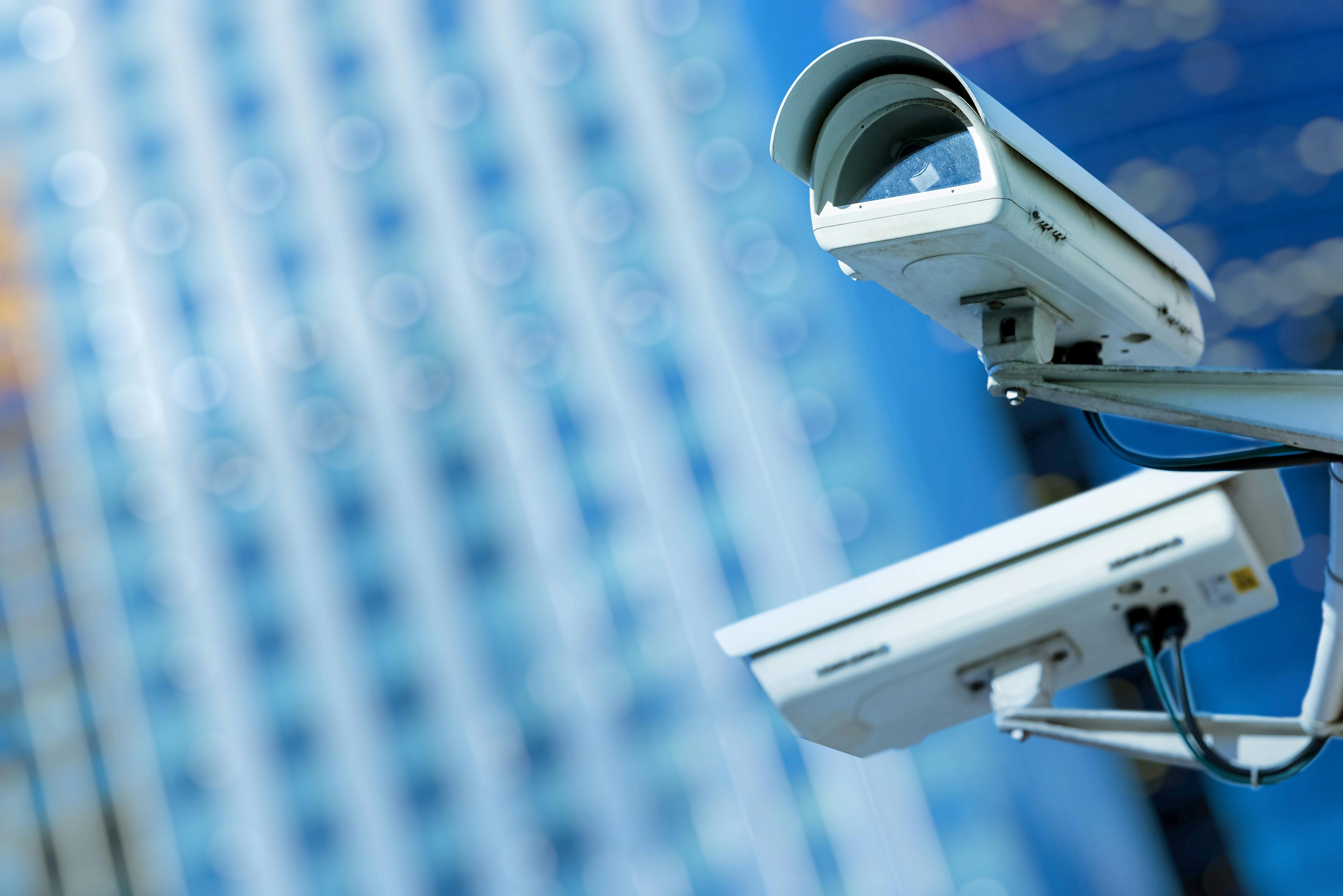 Two security cameras in an urban setting