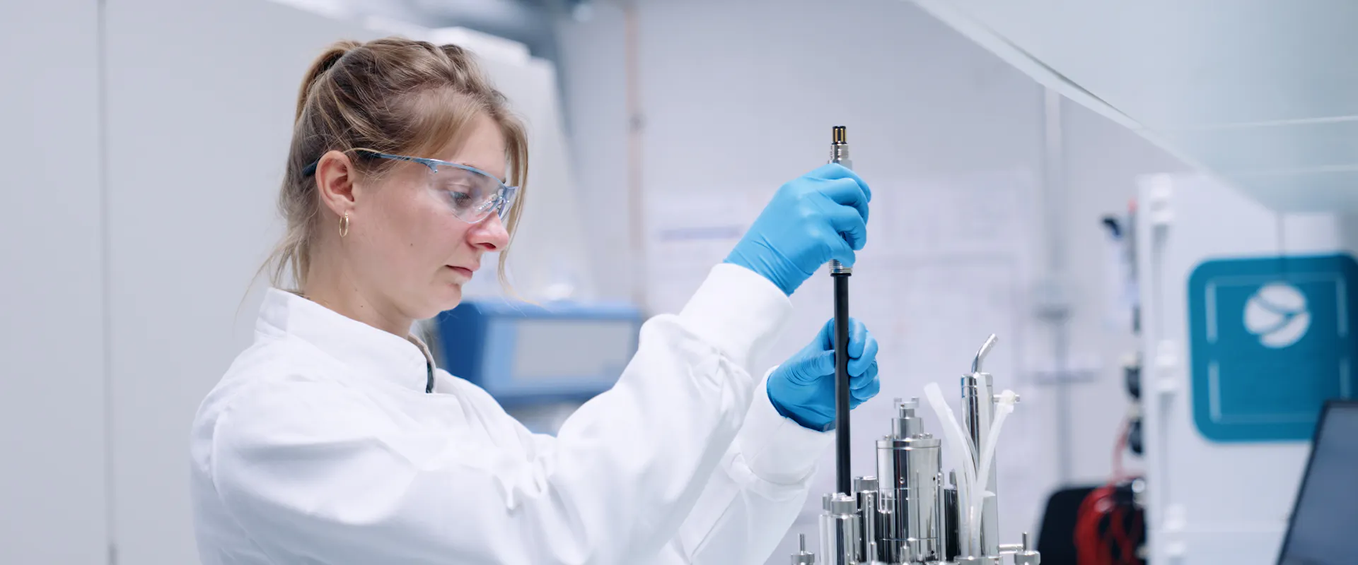 Scientist handling Hamilton’s GlucoSense sensor during installation in a bioreactor for real-time glucose monitoring. Image courtesy of Hamilton Bonaduz AG.