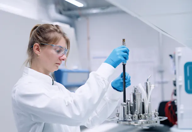 Scientist handling Hamilton’s GlucoSense sensor during installation in a bioreactor for real-time glucose monitoring. Image courtesy of Hamilton Bonaduz AG.