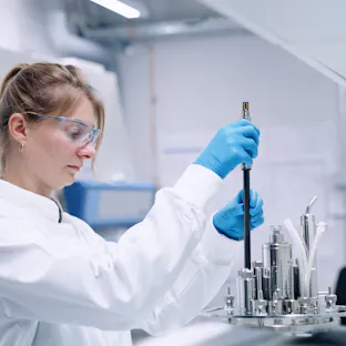 Scientist handling Hamilton’s GlucoSense sensor during installation in a bioreactor for real-time glucose monitoring. Image courtesy of Hamilton Bonaduz AG.