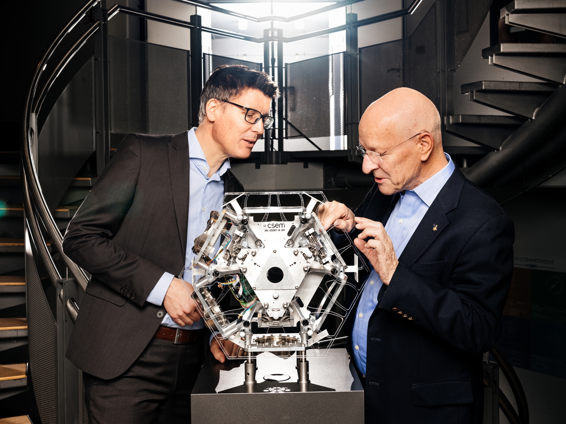 Alexandre Pauchard and Claude Nicollier looking at an advanced 3D-printed system for the European Commission Horizon 2020 funded project PULSAR