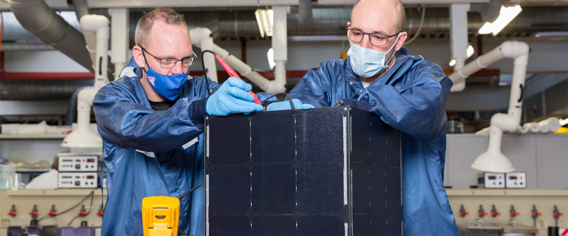 Engineers working on a solar panel