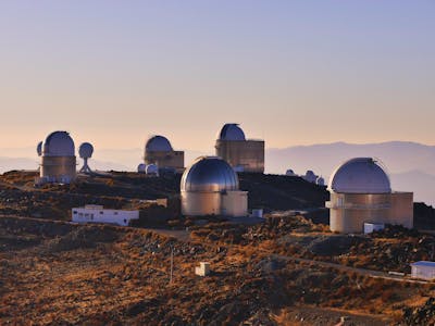 A large observatory on a hill in the Atacama Desert, Chile
