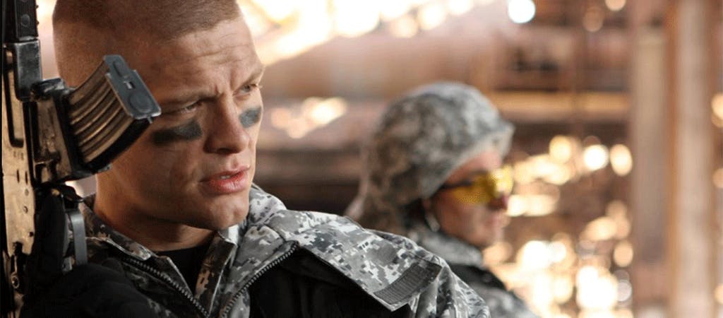 uniformed soldier holding rifle