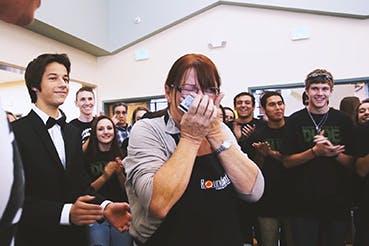 Surprised woman covering her face with her hands