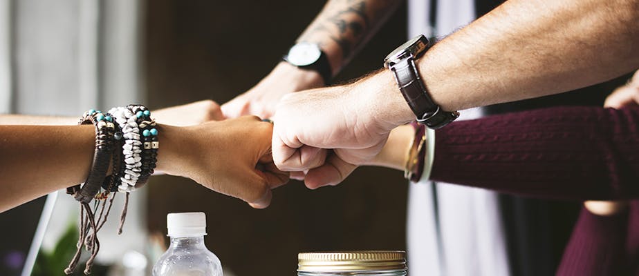 group fistbump with five people