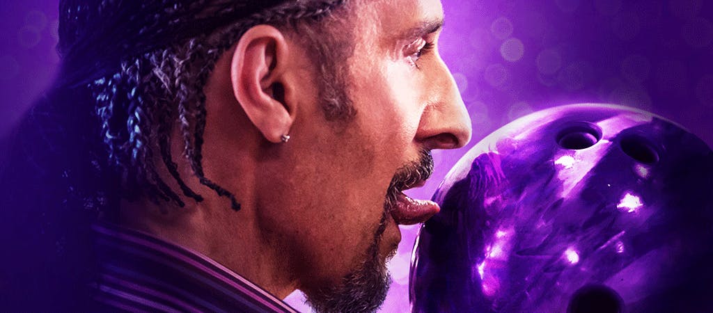 Man licking a purple ball