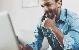 man looking at laptop