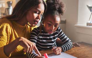 mom helping daughter with homework