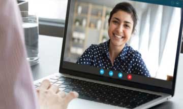Woman interviewing with another woman on video conference
