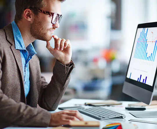 young professional looking at monitor