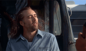 Nicholas cage with long hair blowing in the breeze. From the film Con Air