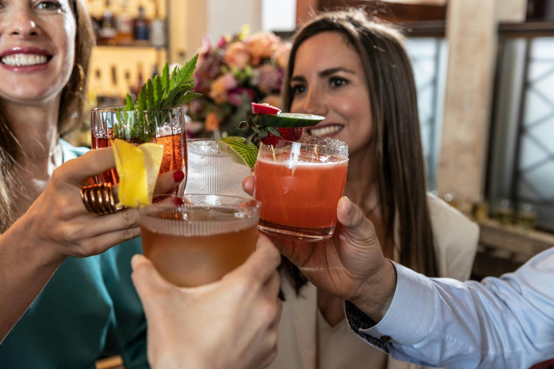 guests toasting with cocktails