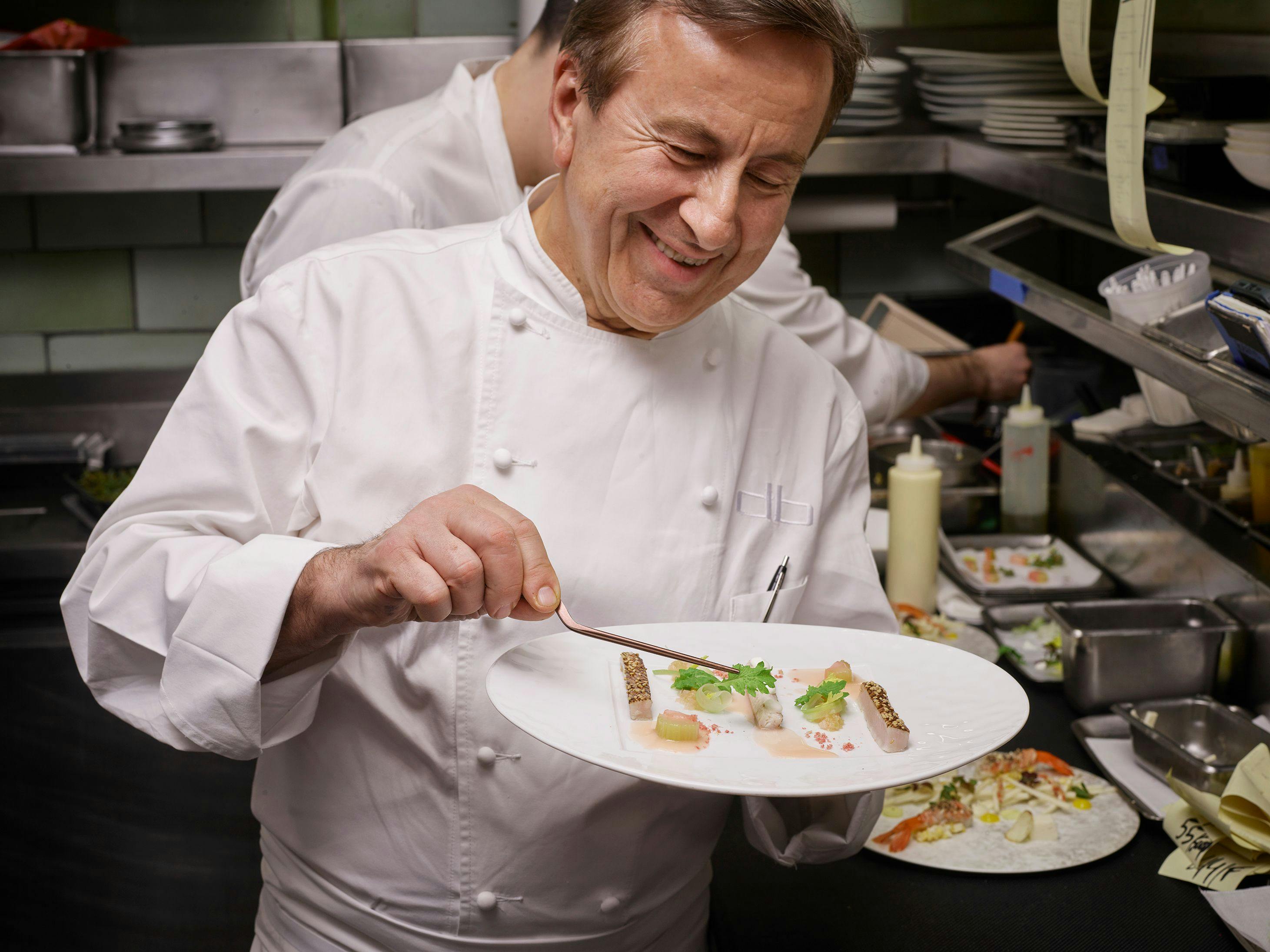 Daniel Boulud plating a dish