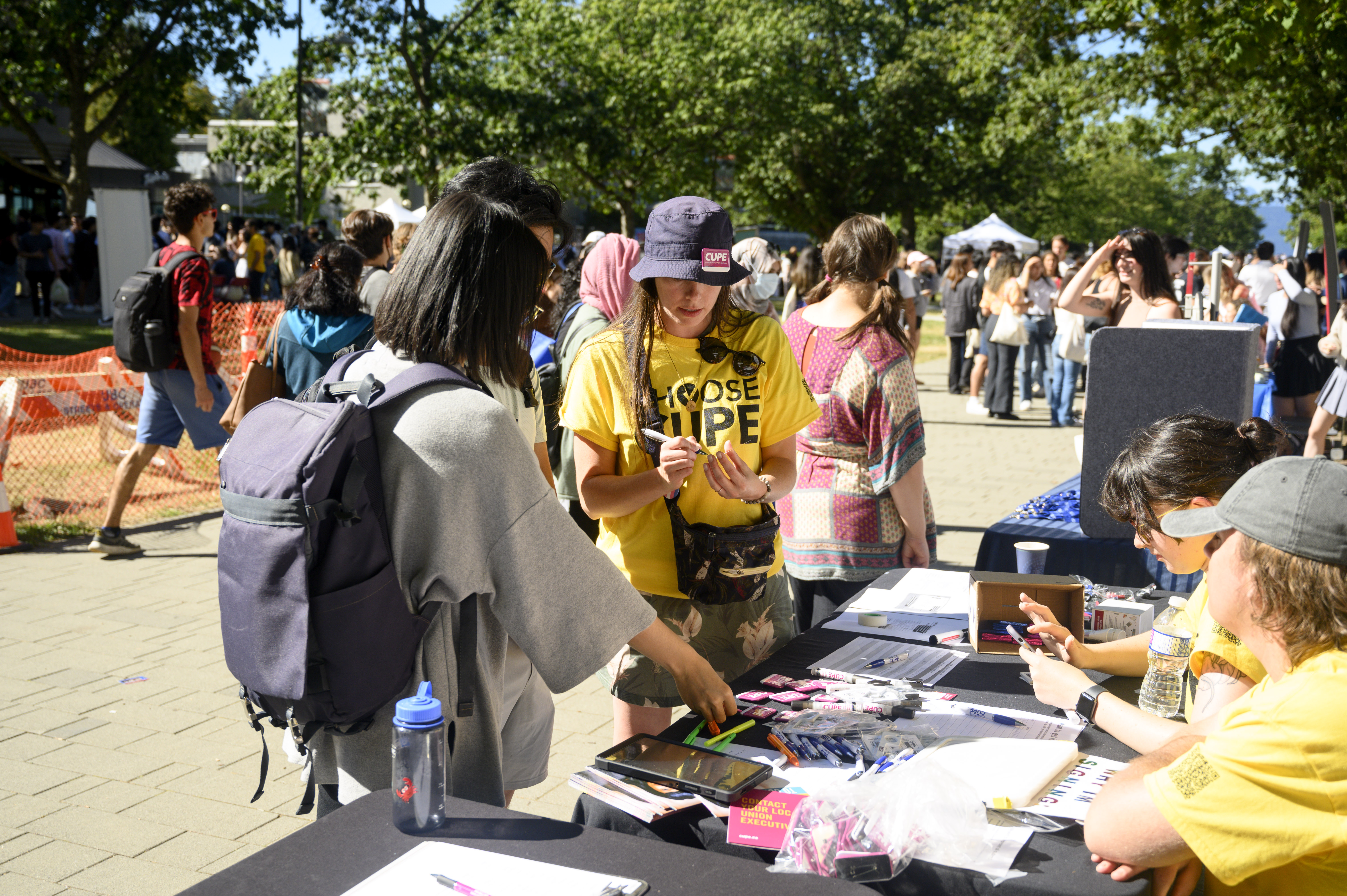 Organize UBC organizers talking to workers at a table during imagine days