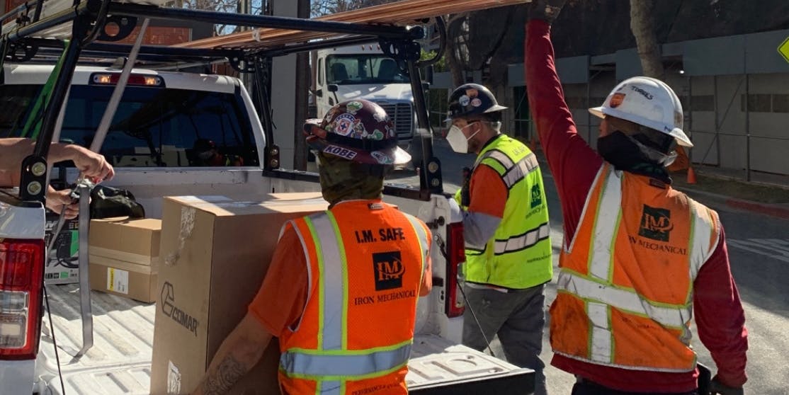 contractors unloading tools delivered by curri