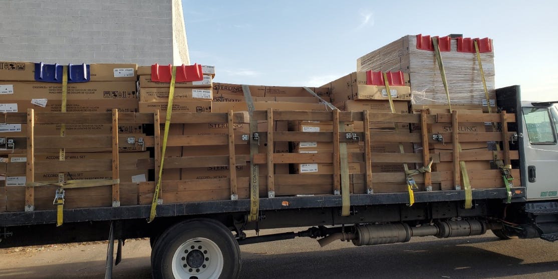 Curri delivery with a stakebed truck