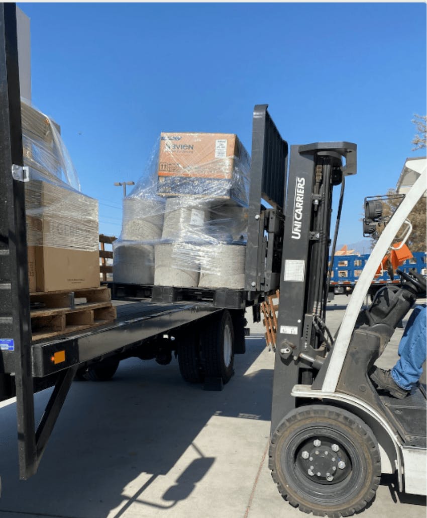 forklift loaded materials into a flatbed