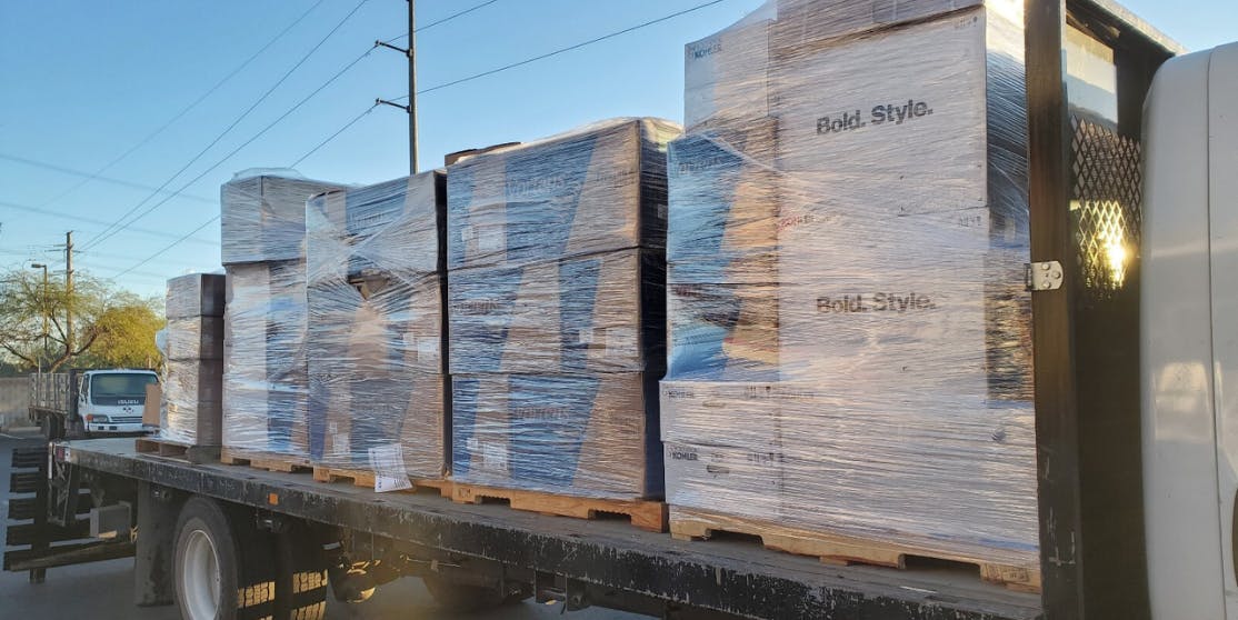 Flatbed truck transporting construction material