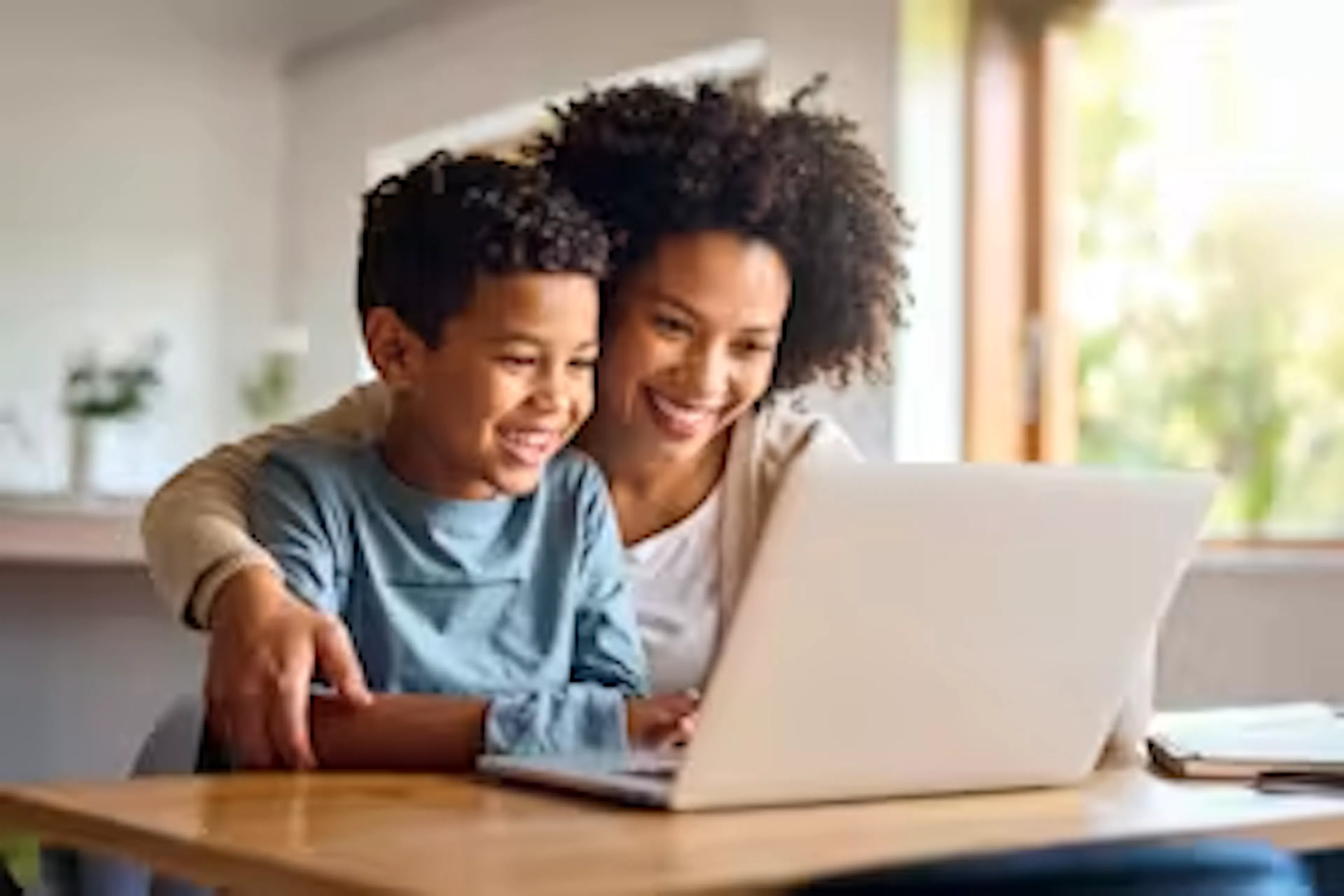 Parent and child using a laptop