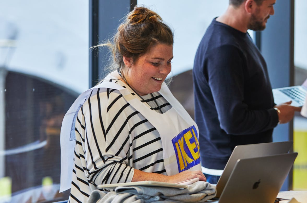 Amy Girdler wearing an IKEA sign on her top as part of a prototype of the future exercise.