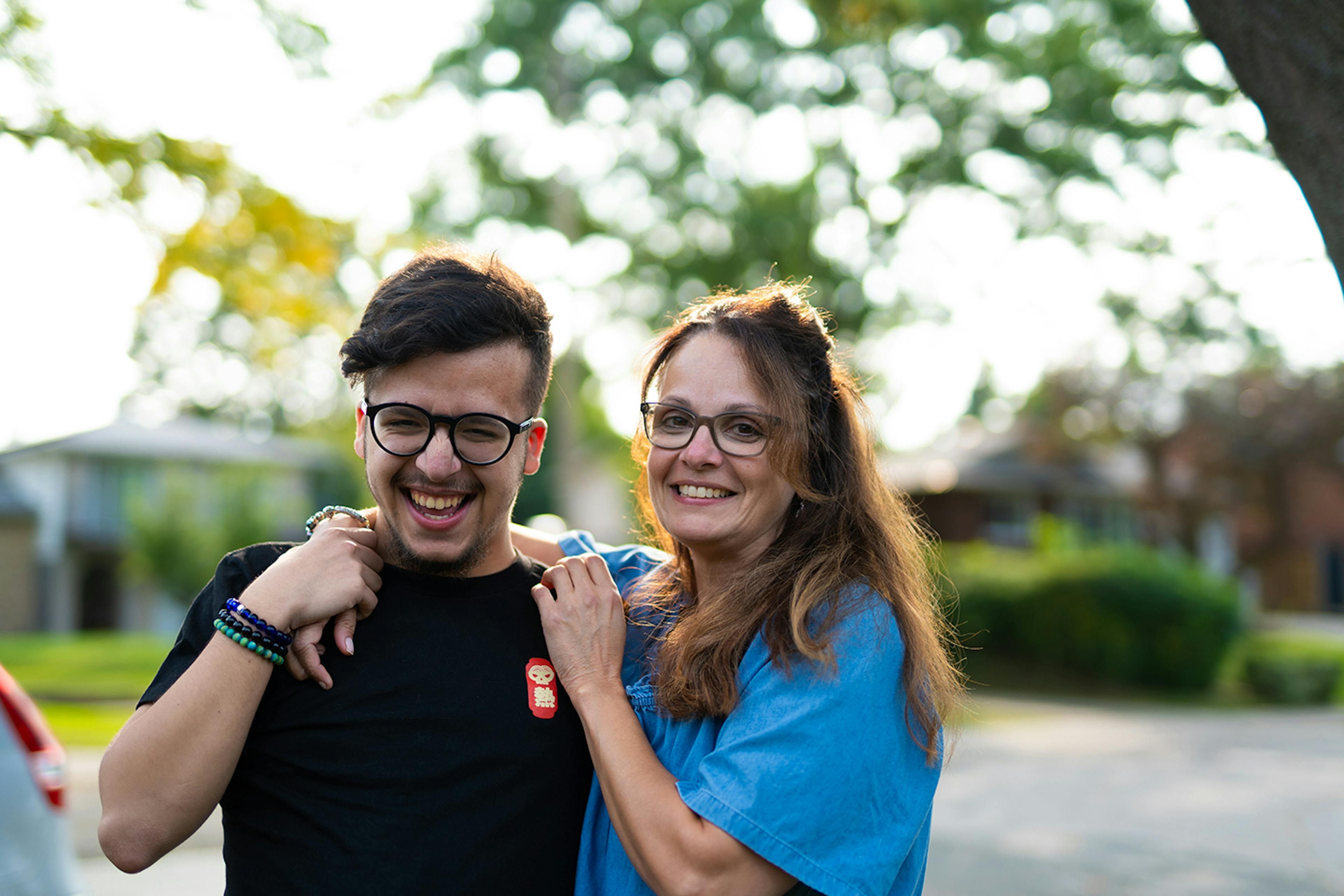 happy man and woman with arm around shoulder