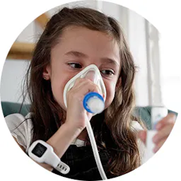 A young girl using breathing apparatus