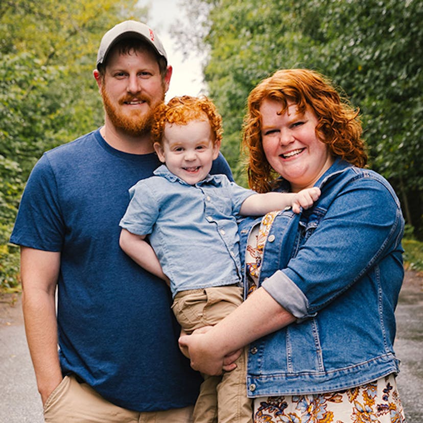 Bethany, her husband Jonathan, and their young son, Zachary, pose in a forest for a family photo. 