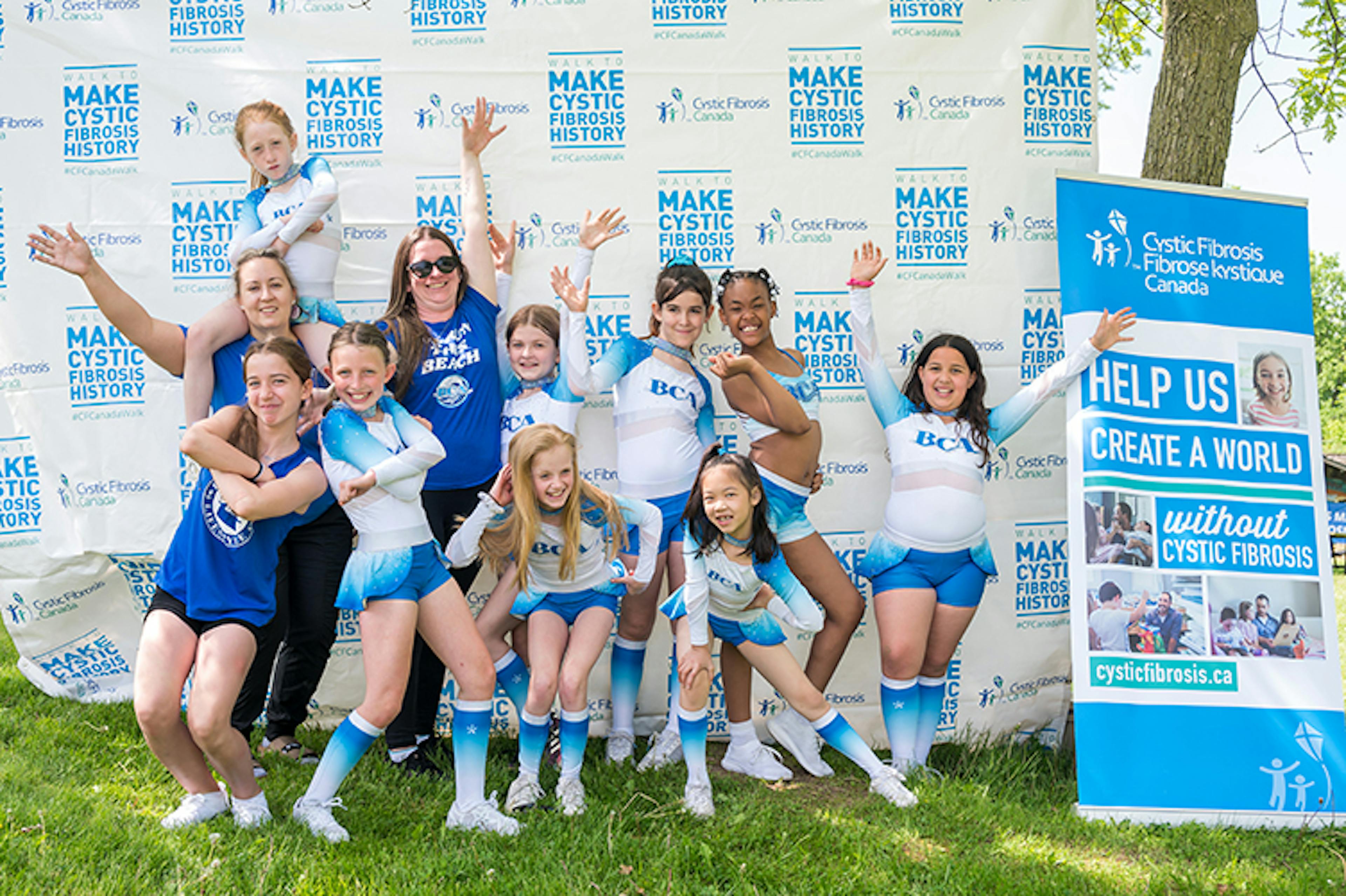 a group of enthusiastic event attendees pose together