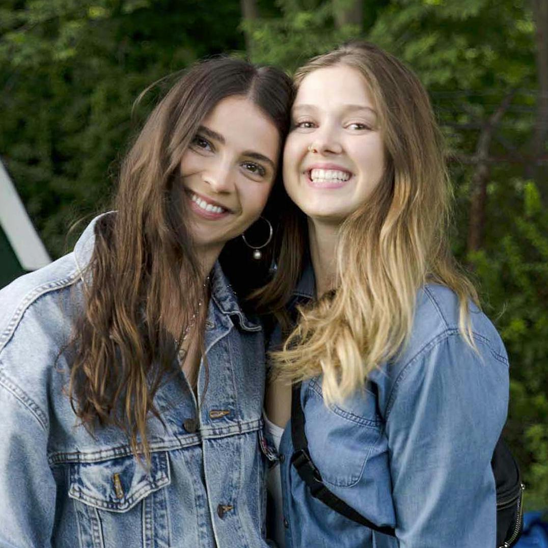 Two young women enjoying fun outdoors.