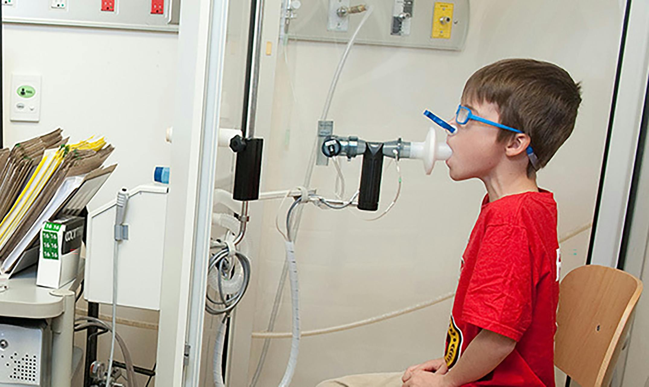 young boy perform breathing test