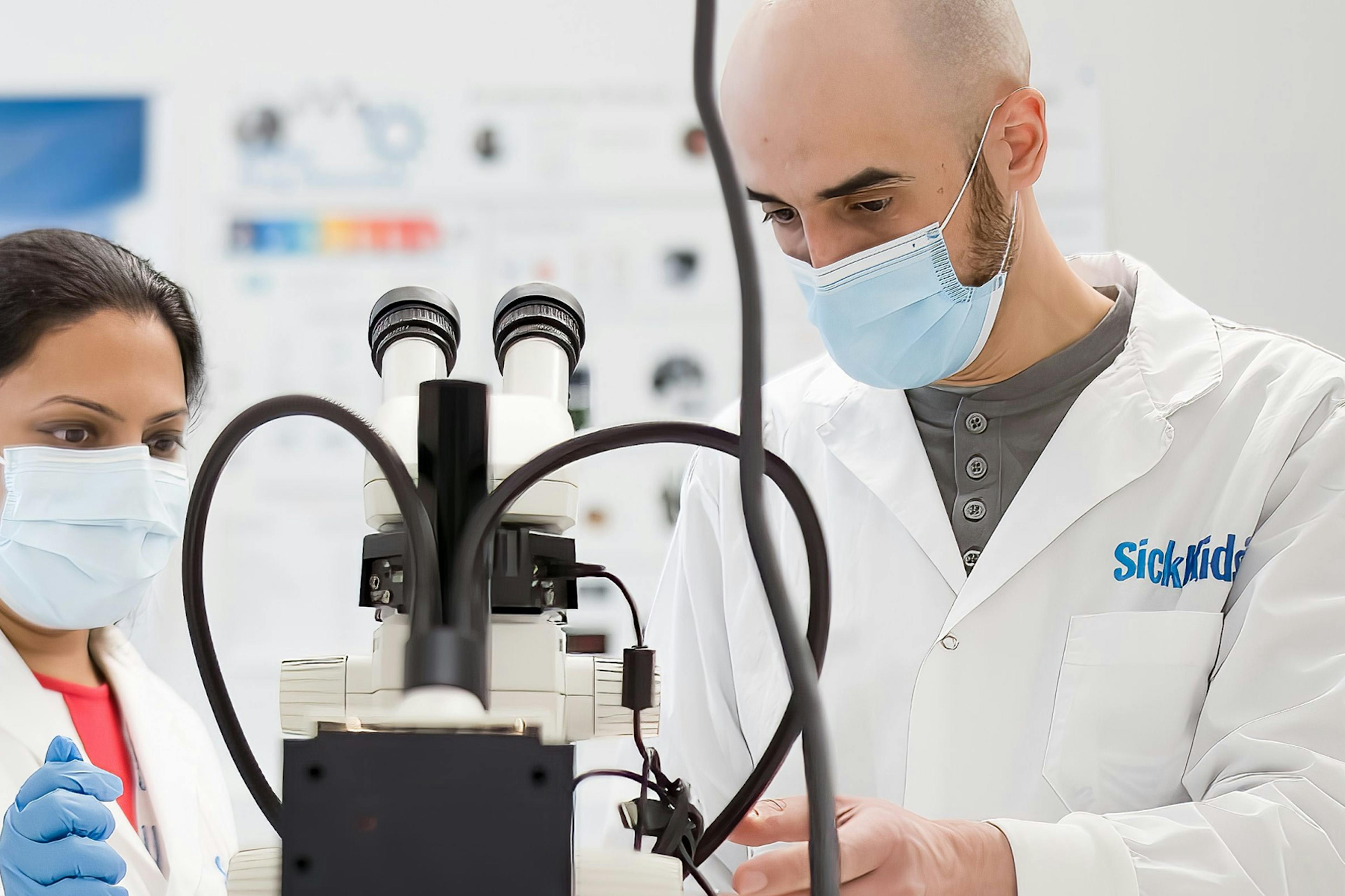 Two lab technicians working in a Sick Kids laboratory.