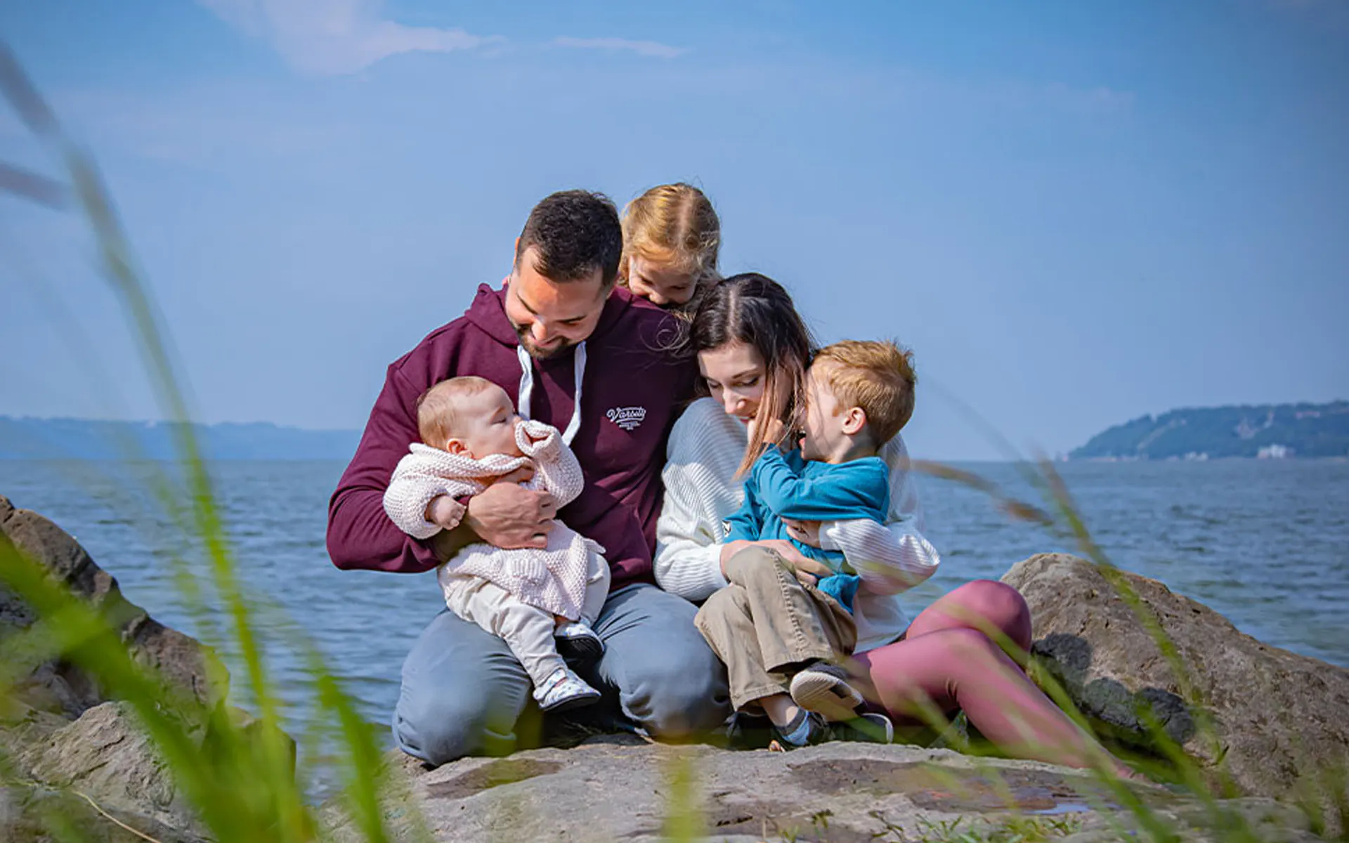 Émerick and his family outside for a family portrait.