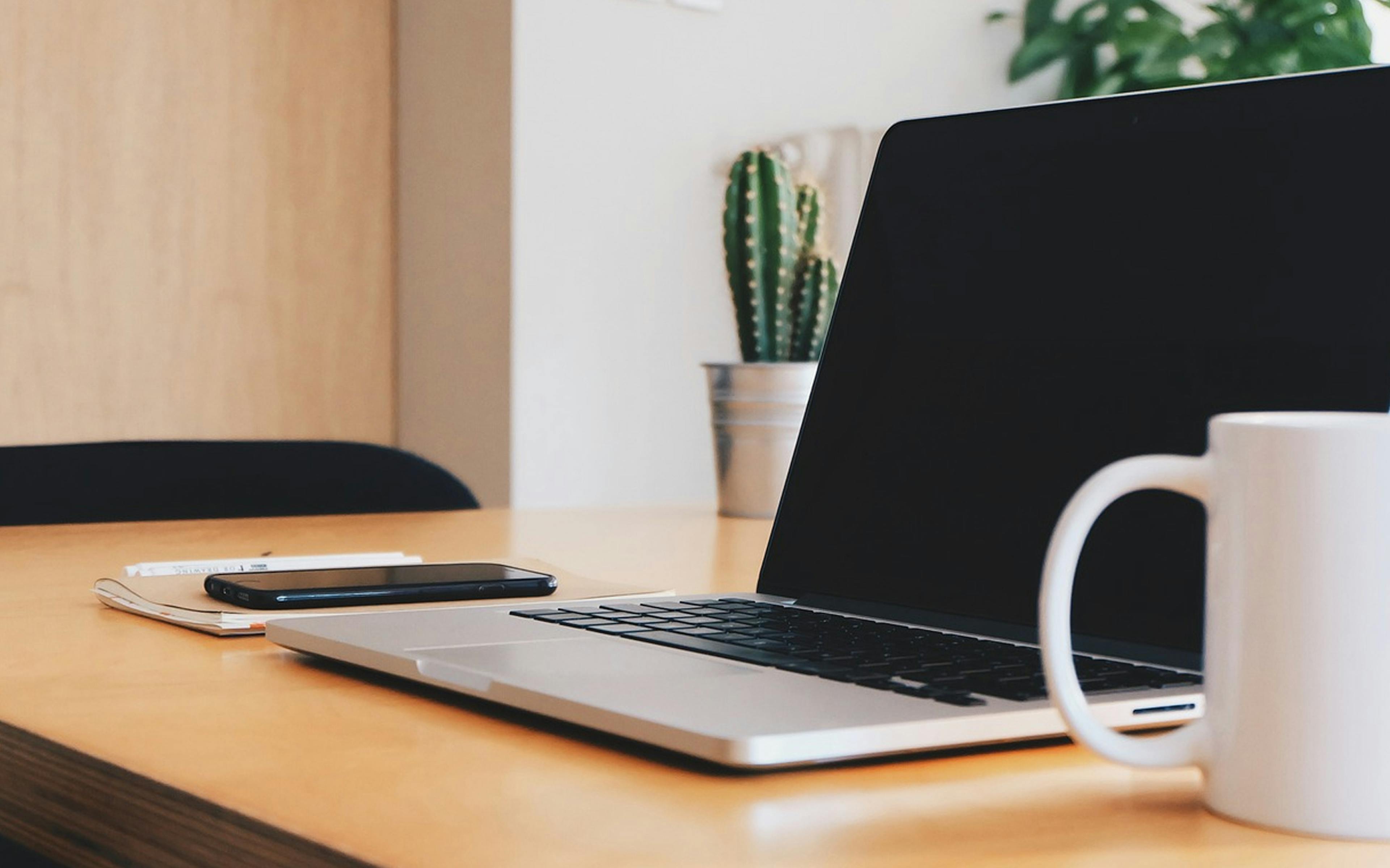 Image of laptop on a work desk