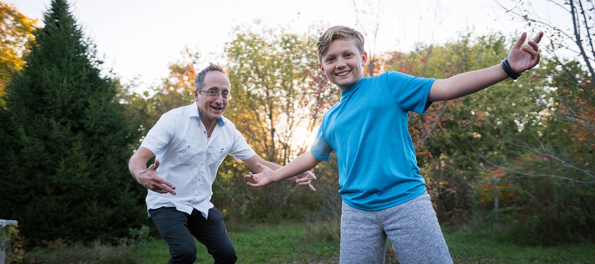 man and boy play outside