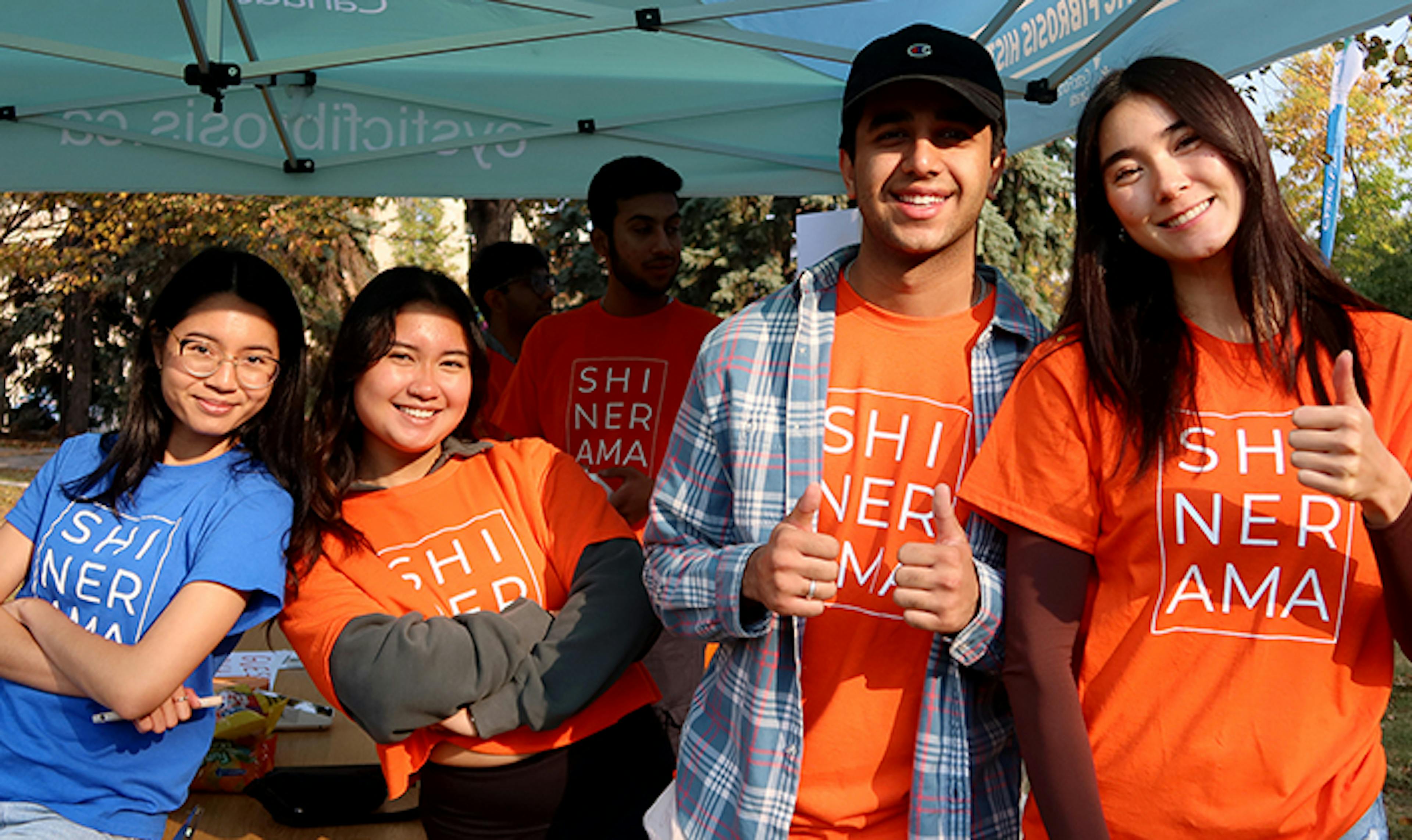 A group young fundraisers gather at an event