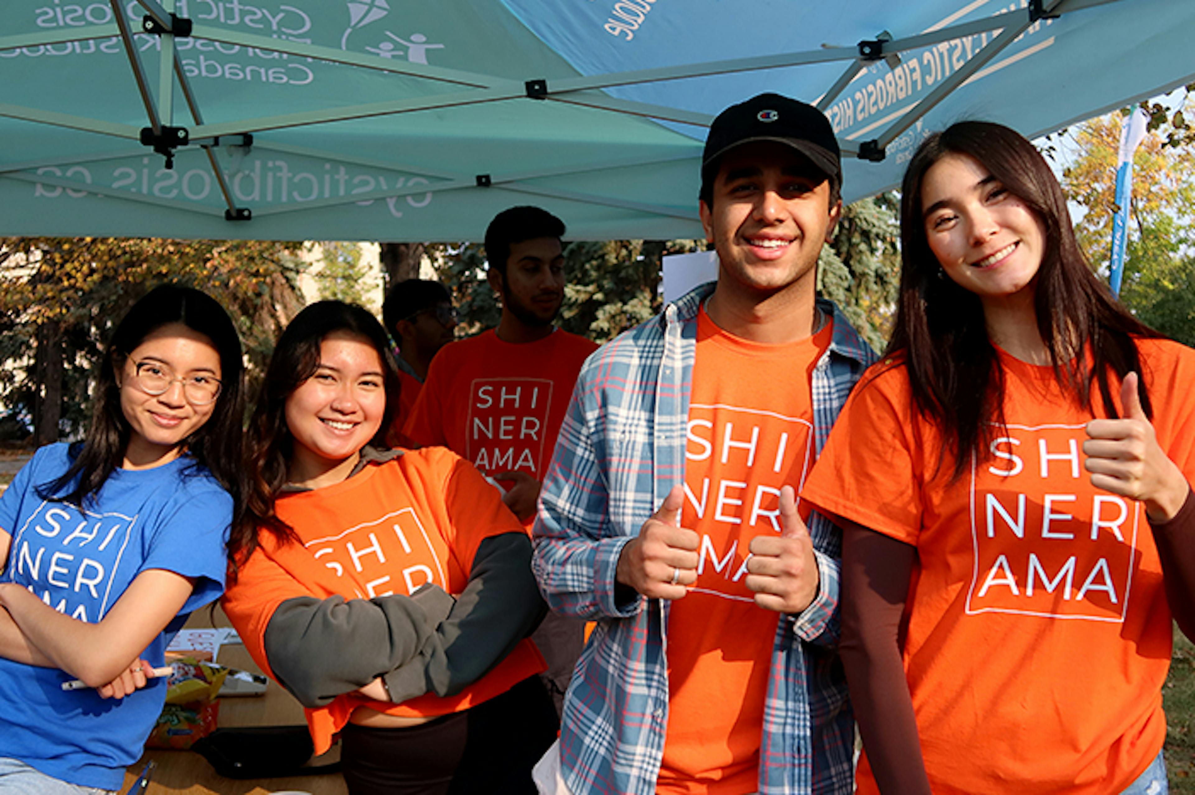 A group young fundraisers gather at an event