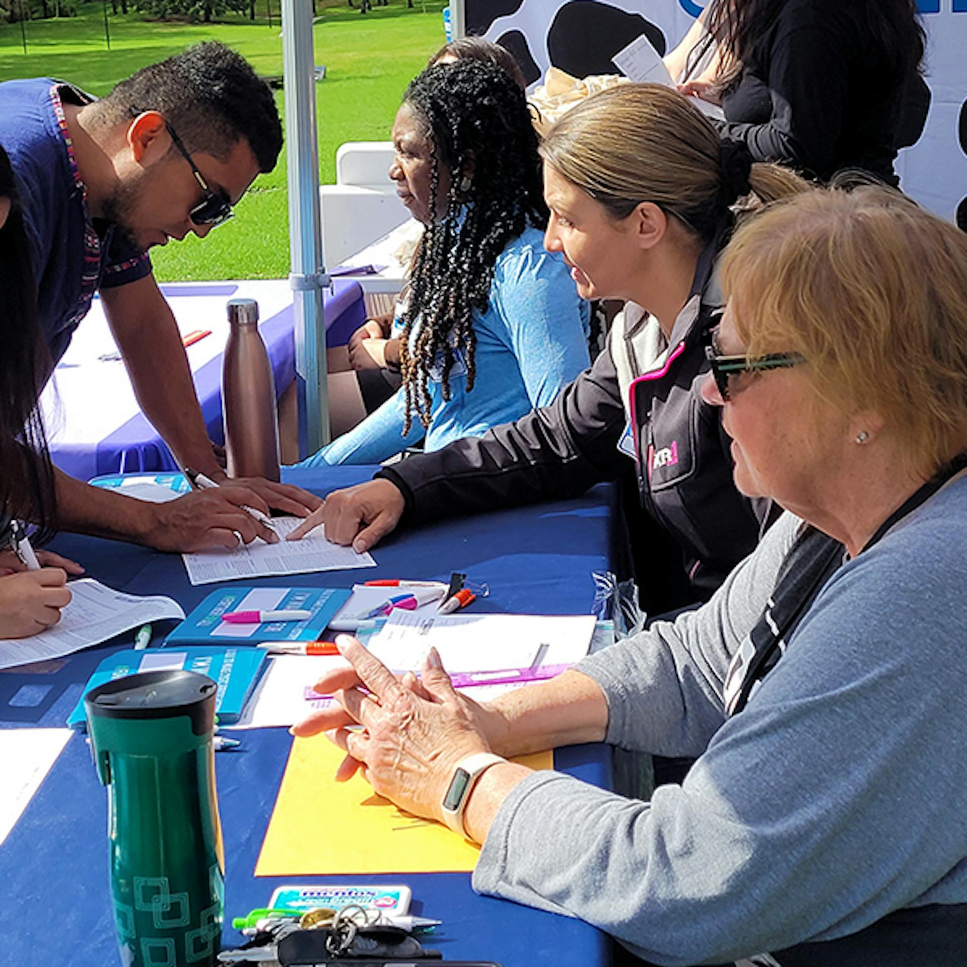 Group of volunteers staff table