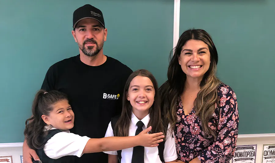 An Elevate member and her family