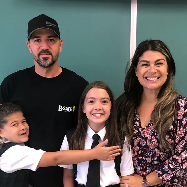 An Elevate member and her family