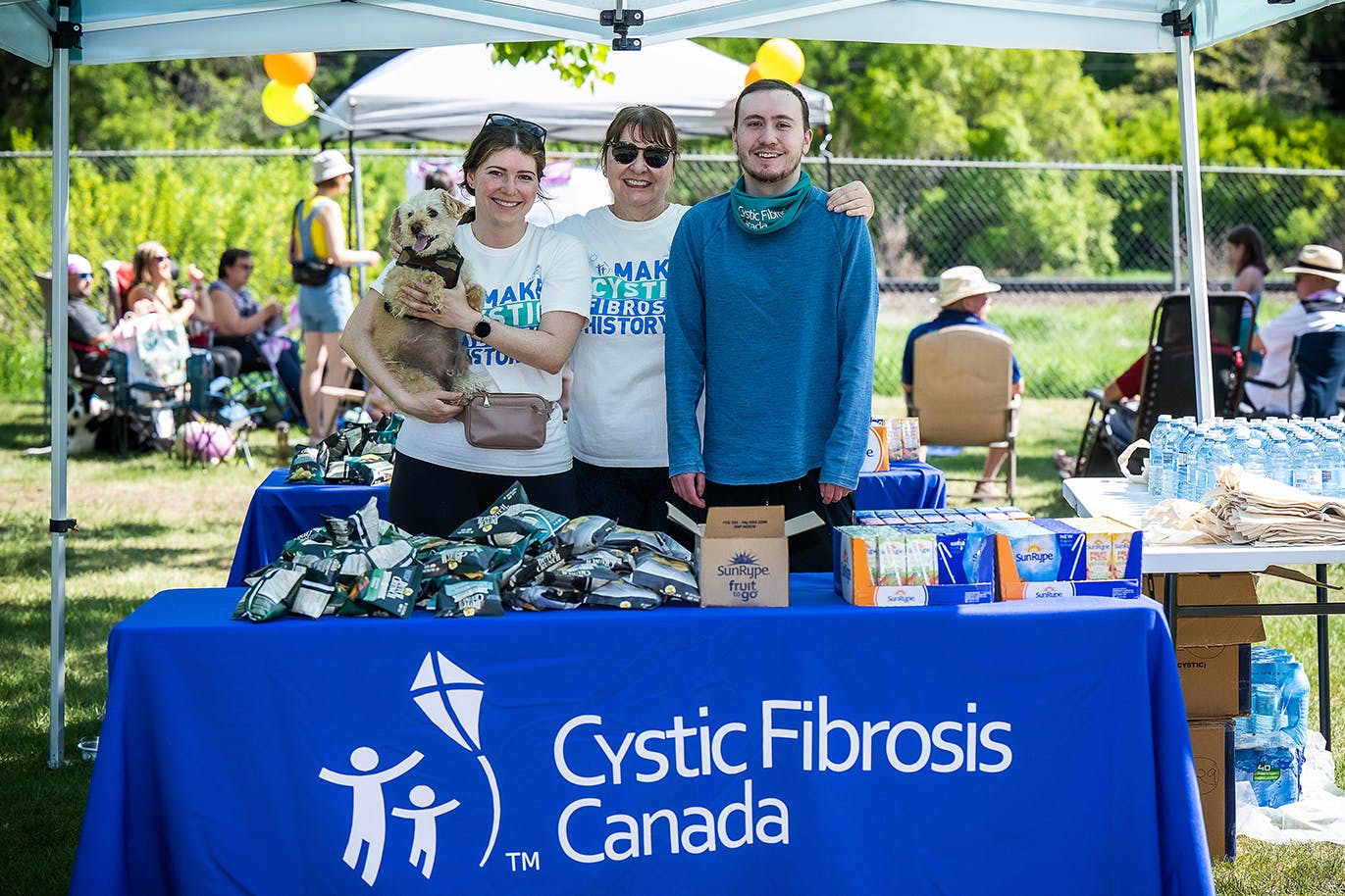 A group of volunteers at event table