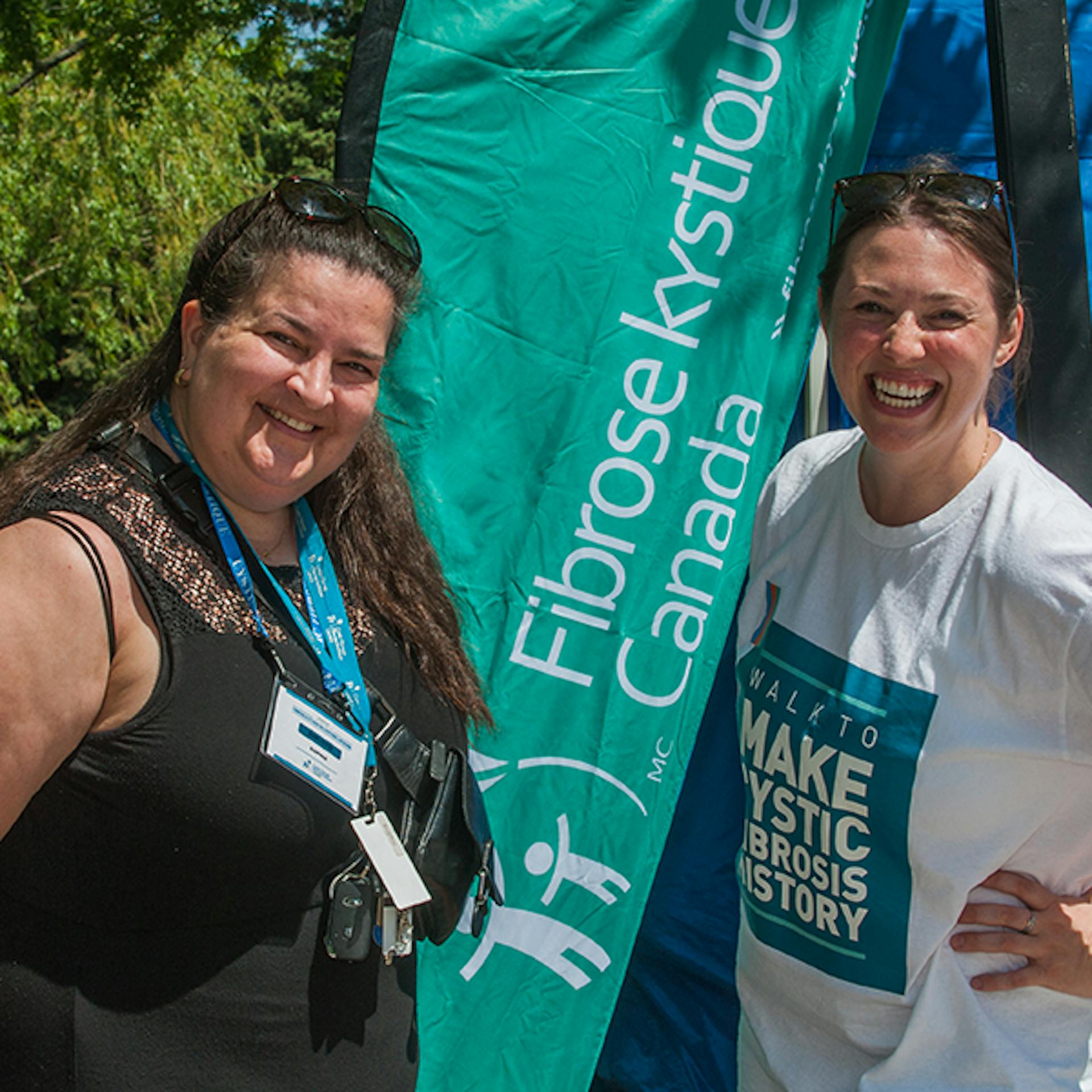 Two CF Canada staff women smile at the camera