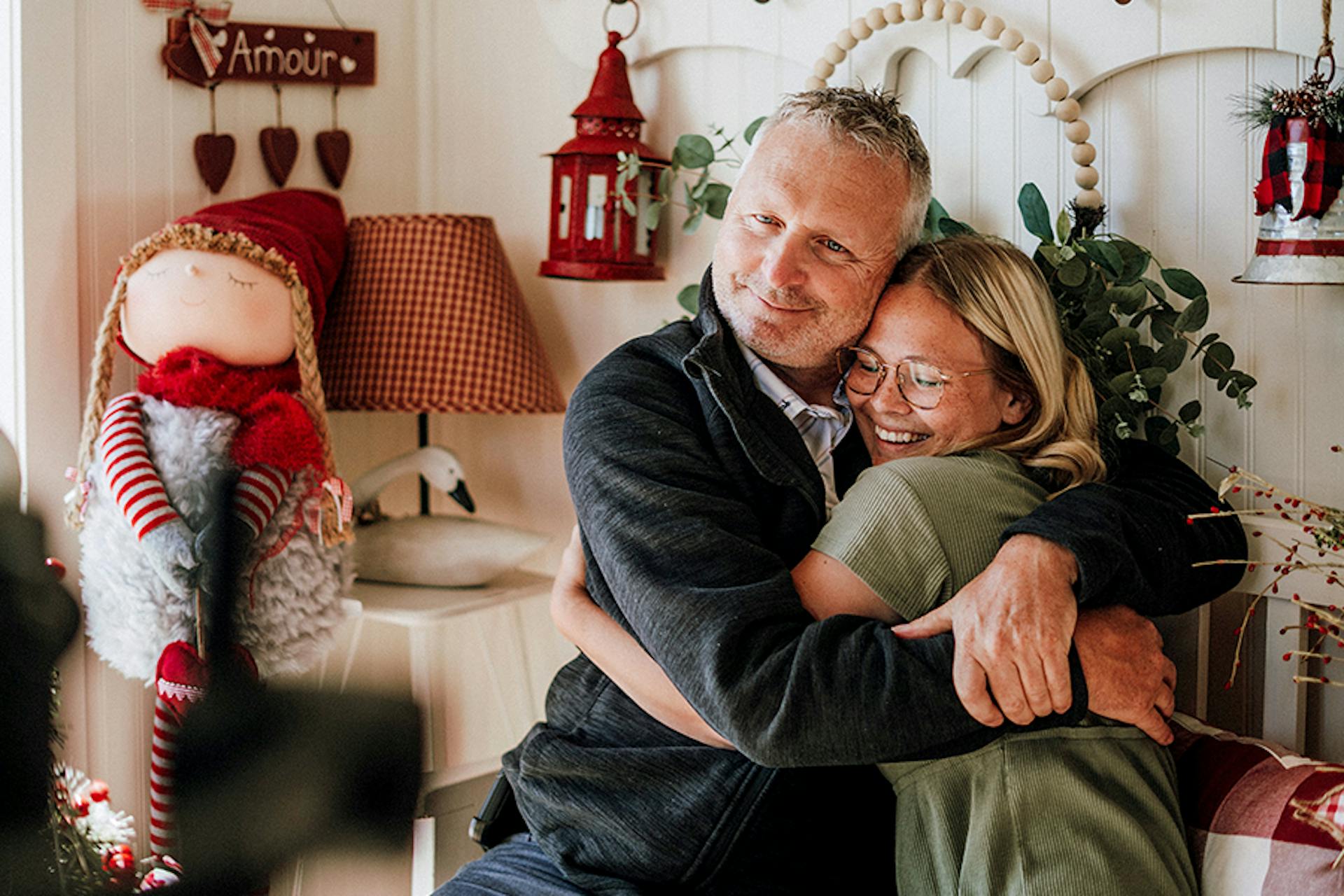 A festive photo of a father hugging his adult daughter who has CF